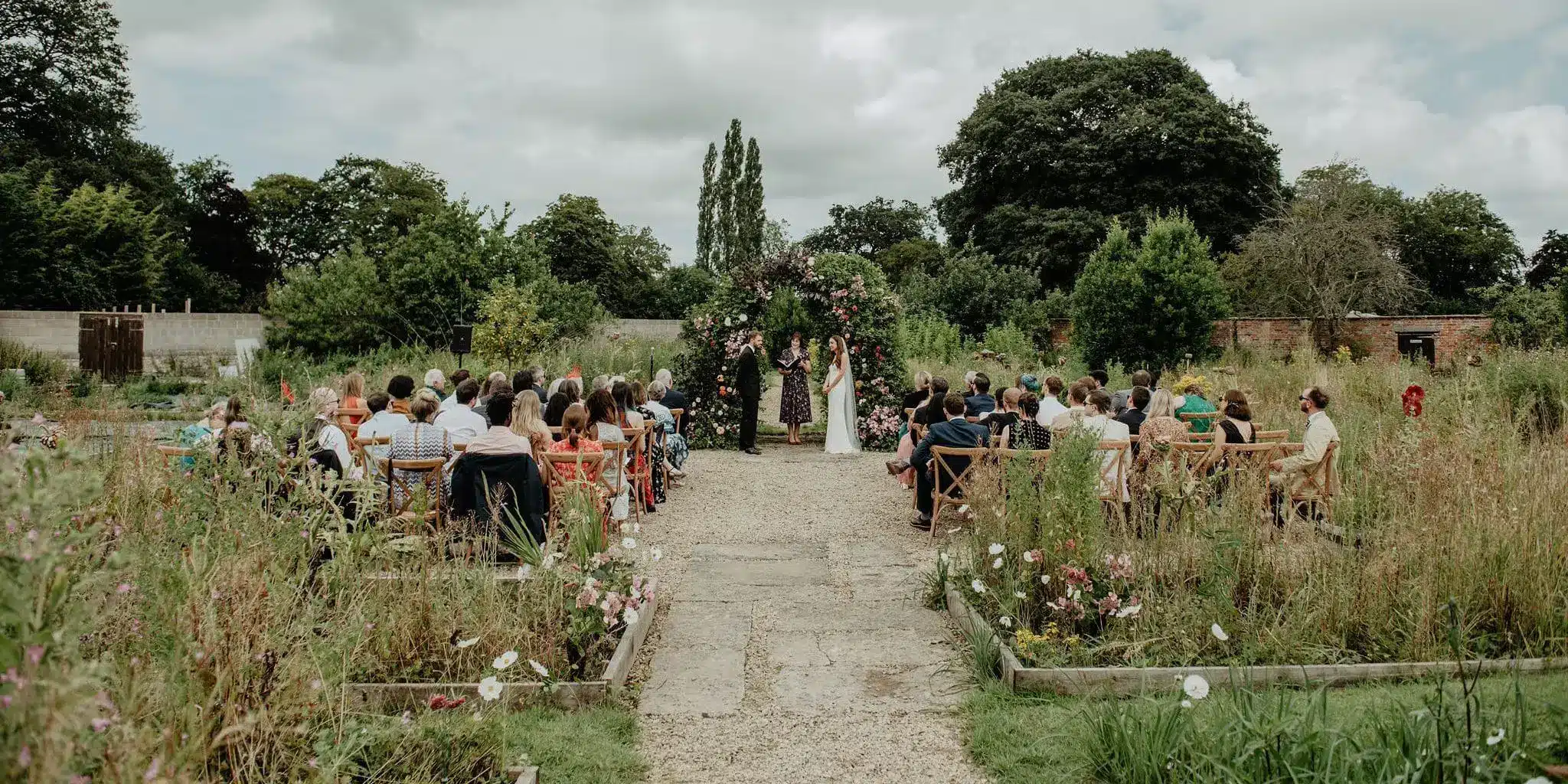 Outdoor wedding ceremony at Mapperton House, Dorset, led by celebrant Alicen Dines
